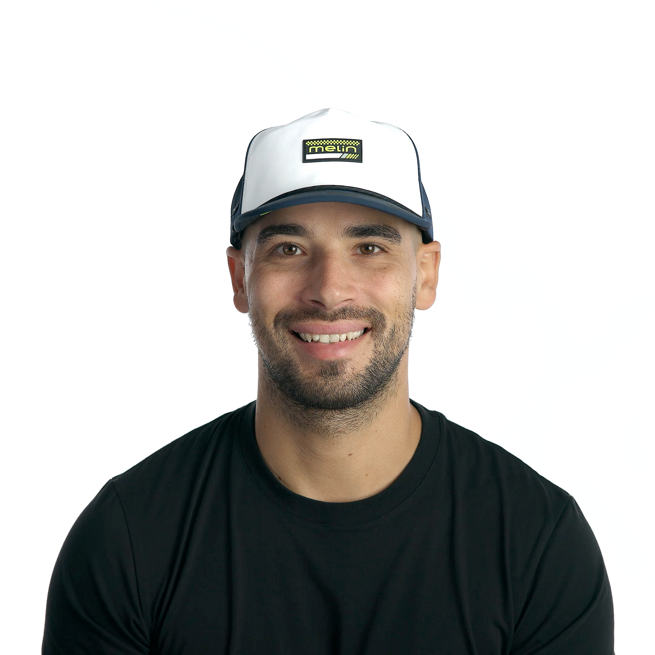 Person wearing Hydro Coronado MPH Black/iris/white Hat, Man wearing black t-shirt and white cap with navy brim against plain