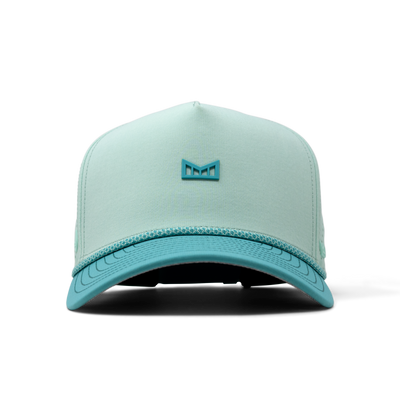 Close-up of Hydro Odyssey Rope Bulls Black Hat showing Light mint crown with teal visor and small teal geometric emblem