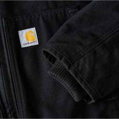 Back of J130 Washed Duck Insulated Active Moss Jacket, Blank back with woven brand label and ribbed knit cuff detail visible