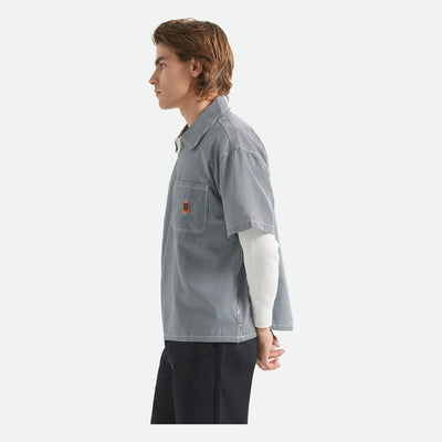 Person wearing Journey LW SS Woven Navy/white Stripe S/S Woven S/S Woven, White studio backdrop with neutral lighting and