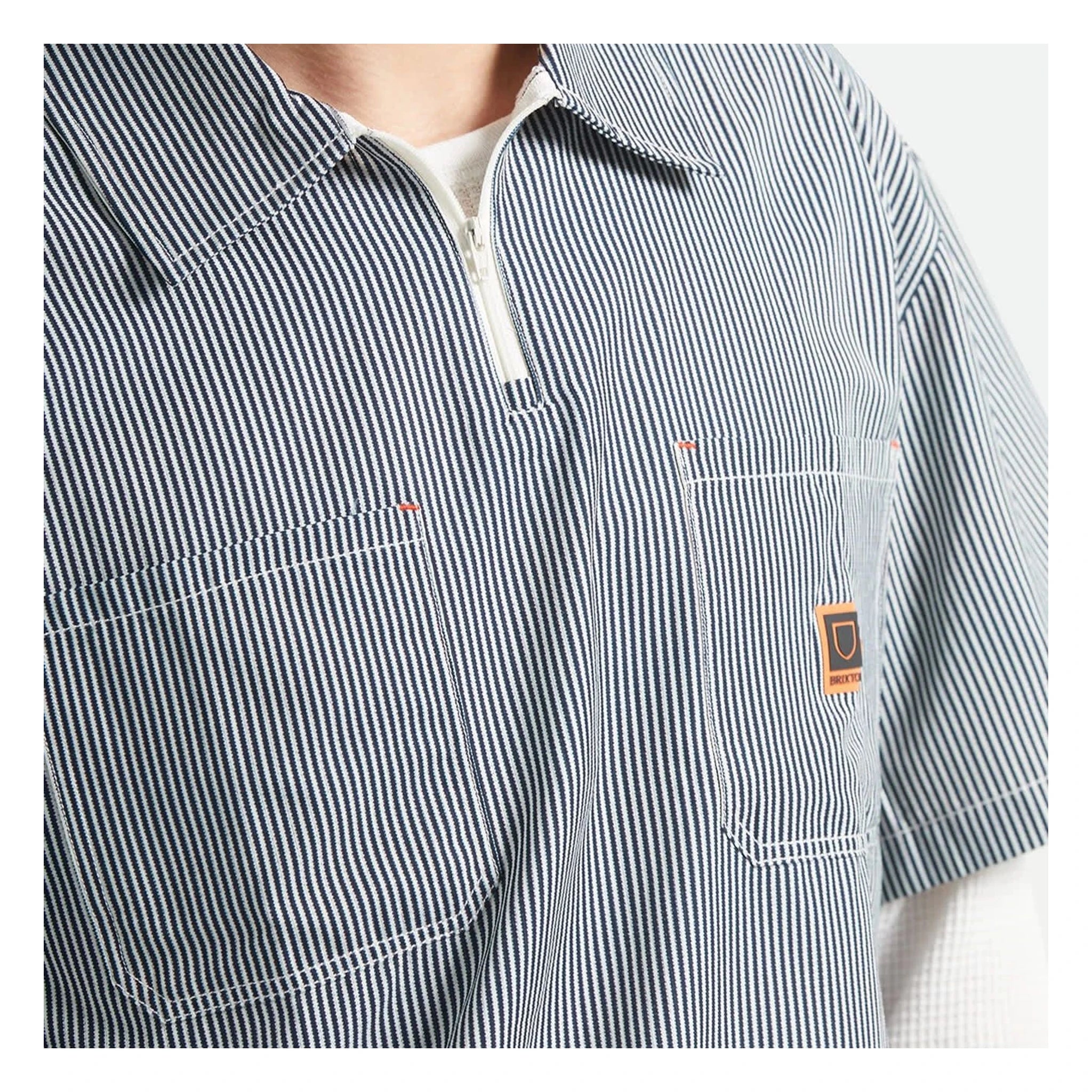 Close-up of Journey LW SS Woven Navy/white Stripe S/S Woven S/S Woven showing Navy and white vertical striped fabric with