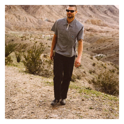 Person wearing Journey LW SS Woven Navy/white Stripe S/S Woven S/S Woven, Man in grey polo shirt standing on desert dirt