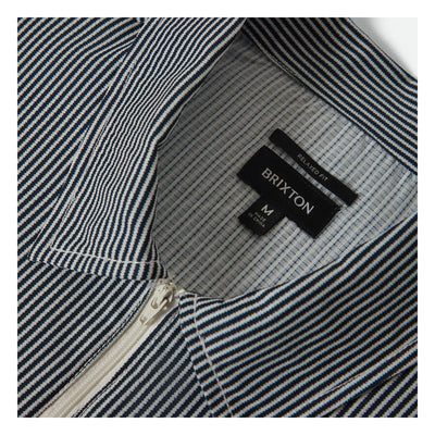 Care label on Journey LW SS Woven Navy/white Stripe S/S Woven S/S Woven showing Black label with white text reading