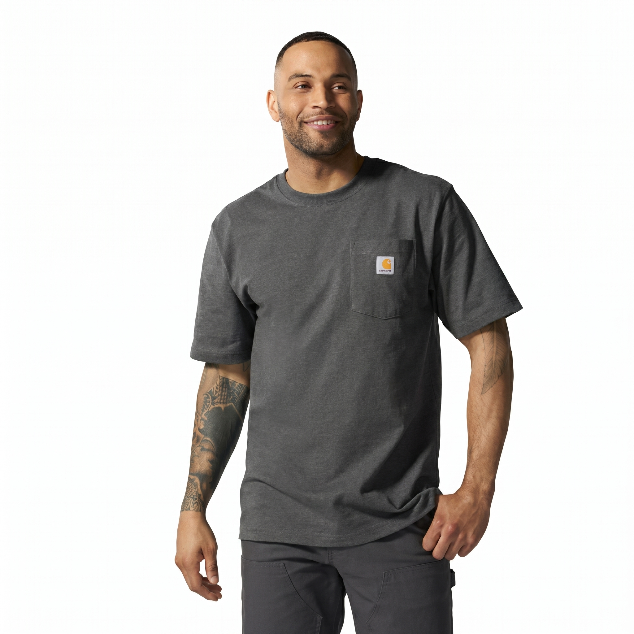 Person wearing K87 (reg) Black Tee, Man wearing charcoal tee against plain white studio background - Slowride Supply