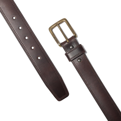Close-up of Leather Engraved Buckle Belt Accessory Brown Accessory showing Brown leather belt with brass rectangular buckle