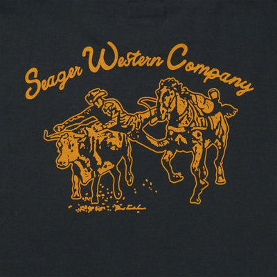 Close-up of Los Rios Vintage Black Tee showing Gold outline graphic showing two bucking horses with "Seager Western Company"