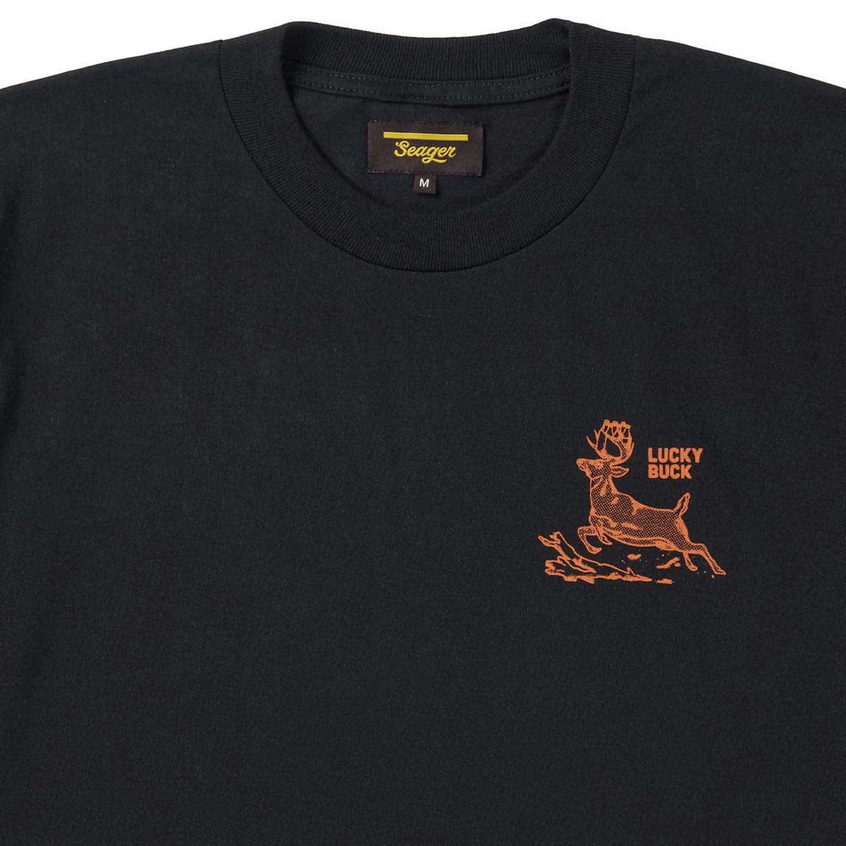 Close-up of Lucky Buck Black Tee showing Ribbed crew neckline with woven label visible at collar seam - Slowride Supply