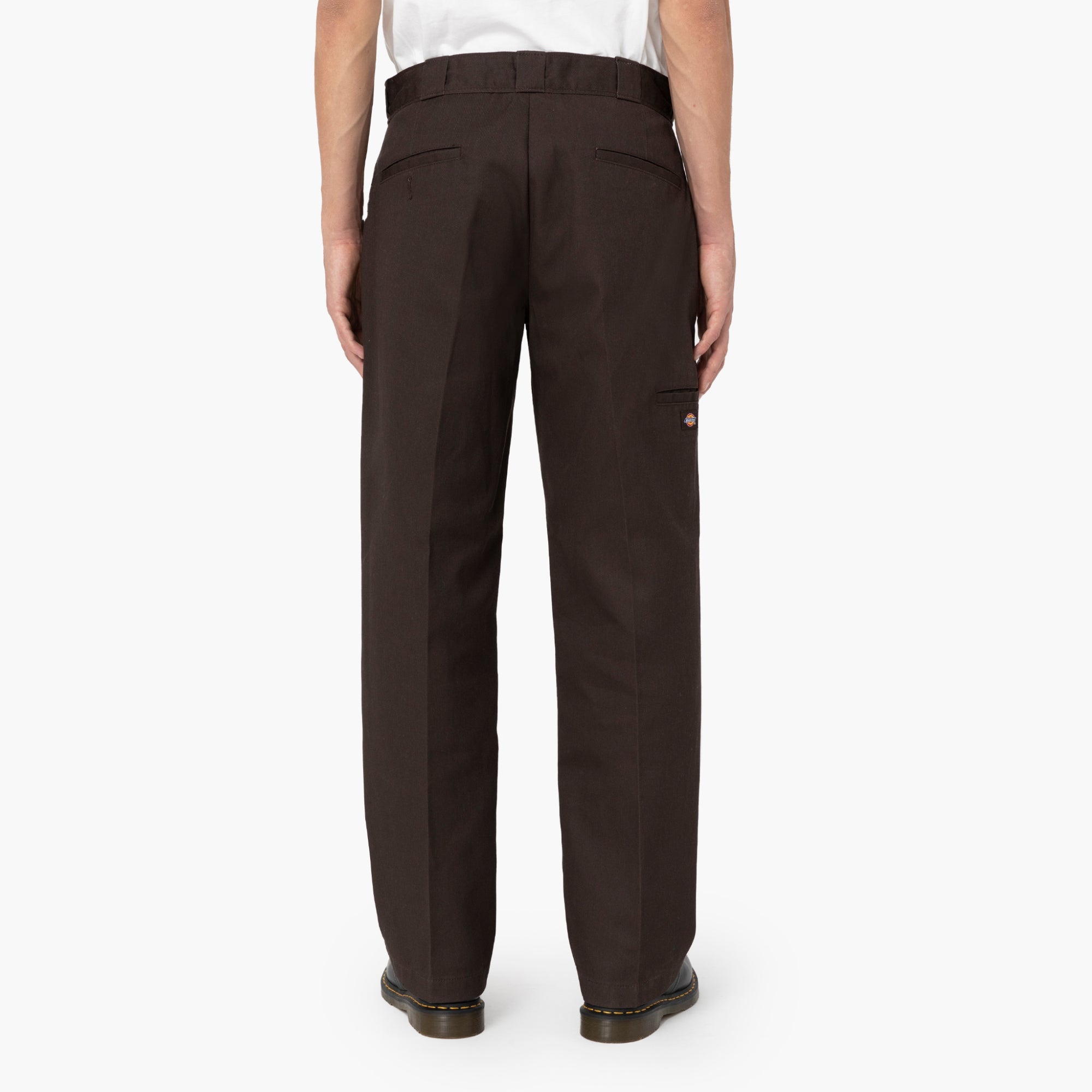 Person wearing Mens Twill Double Knee Work Pant (85283) Pants Dark Brown Pants, Wearer standing against neutral white