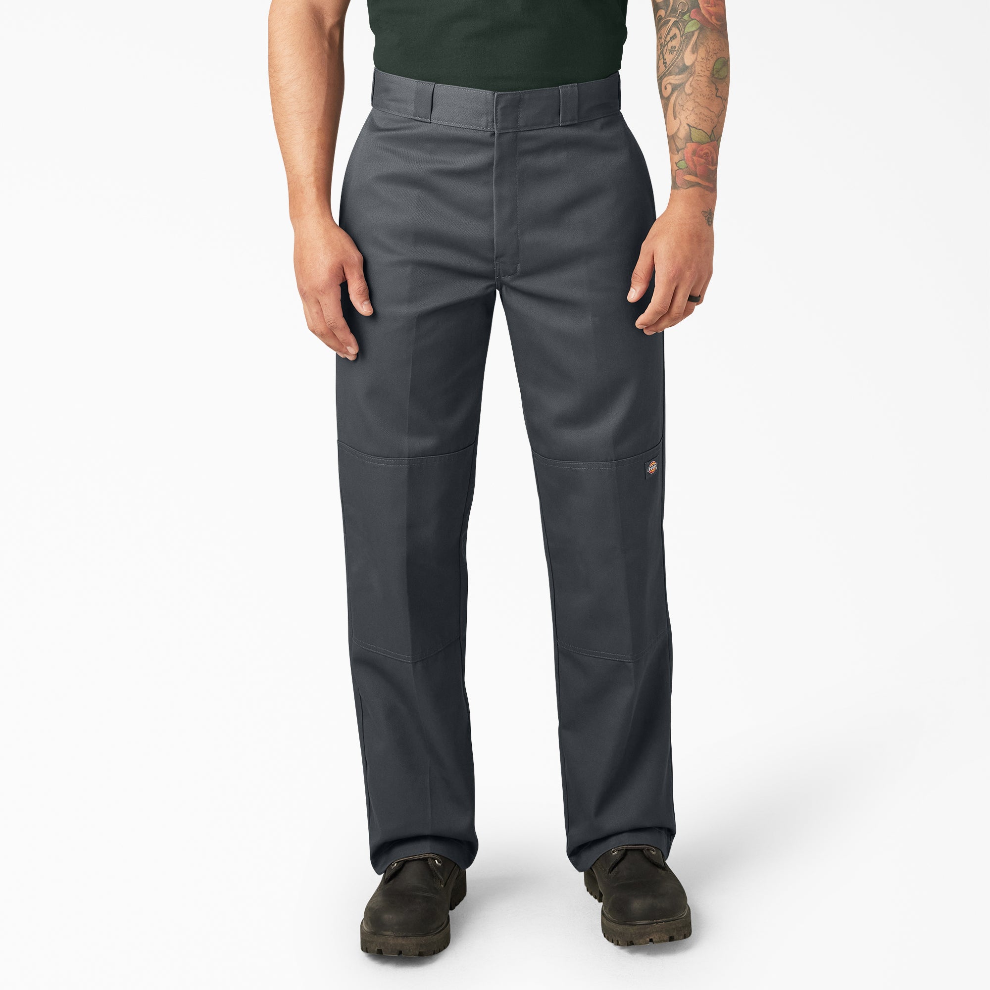 Person wearing Mens Twill Double Knee Work Pant (85283) Pants Dark Brown Pants, Man standing in neutral studio setting