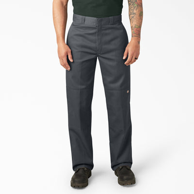 Person wearing Mens Twill Double Knee Work Pant (85283) Pants Dark Brown Pants, Man standing in neutral studio setting
