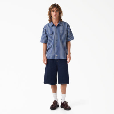 Person wearing Mens Worn in Lightweight Work Shirt S/S Woven Black S/S Woven, Plain white background studio setting with