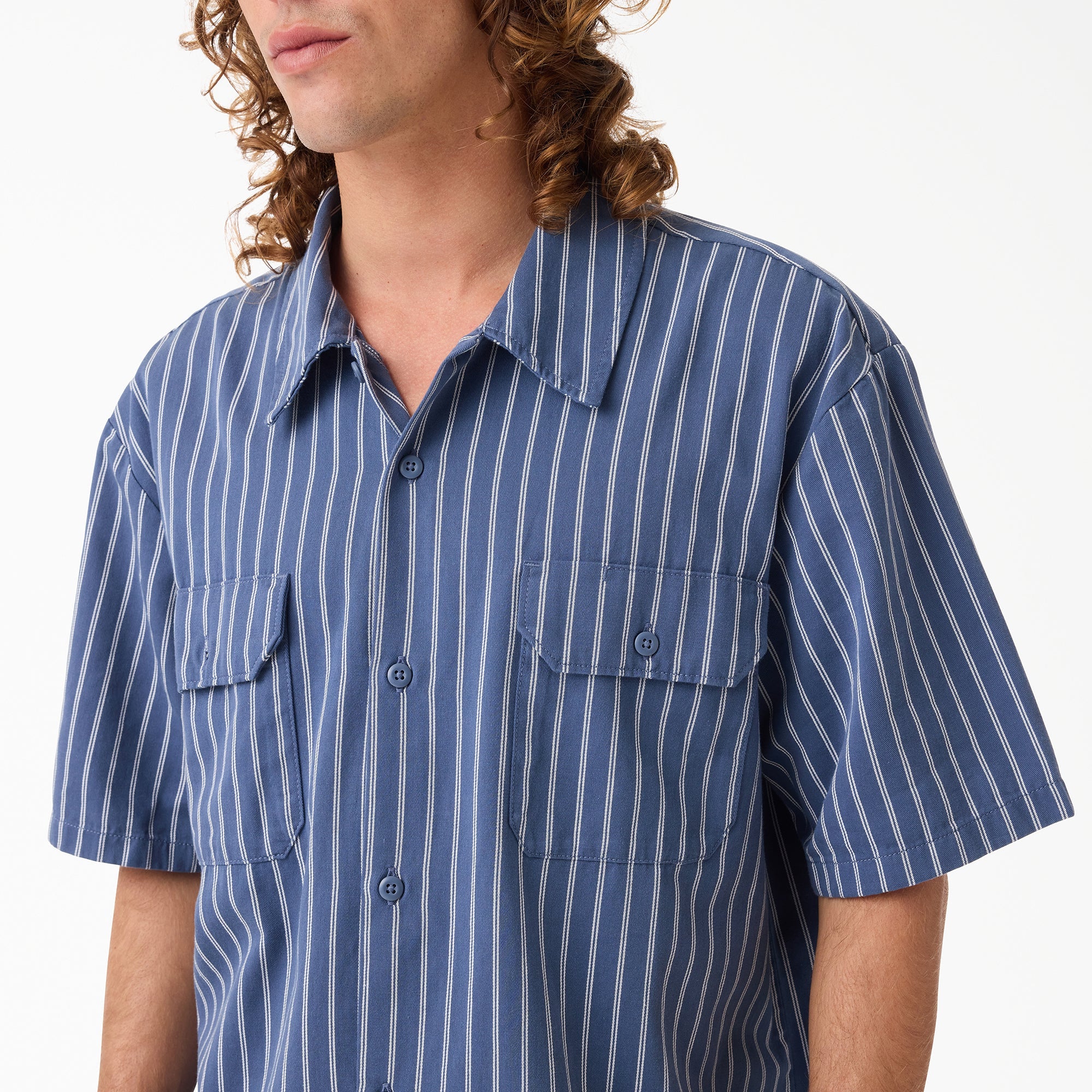 Person wearing Mens Worn in Lightweight Work Shirt S/S Woven Black S/S Woven, Model wearing blue pinstriped work shirt