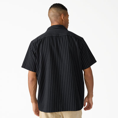Person wearing Mens Worn in Lightweight Work Shirt S/S Woven Black S/S Woven, Man wearing black pinstriped shirt against