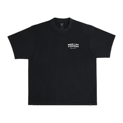 Close-up of Money Shot Heavyweight Tee showing Black heavyweight cotton with small white chest print and script text reading
