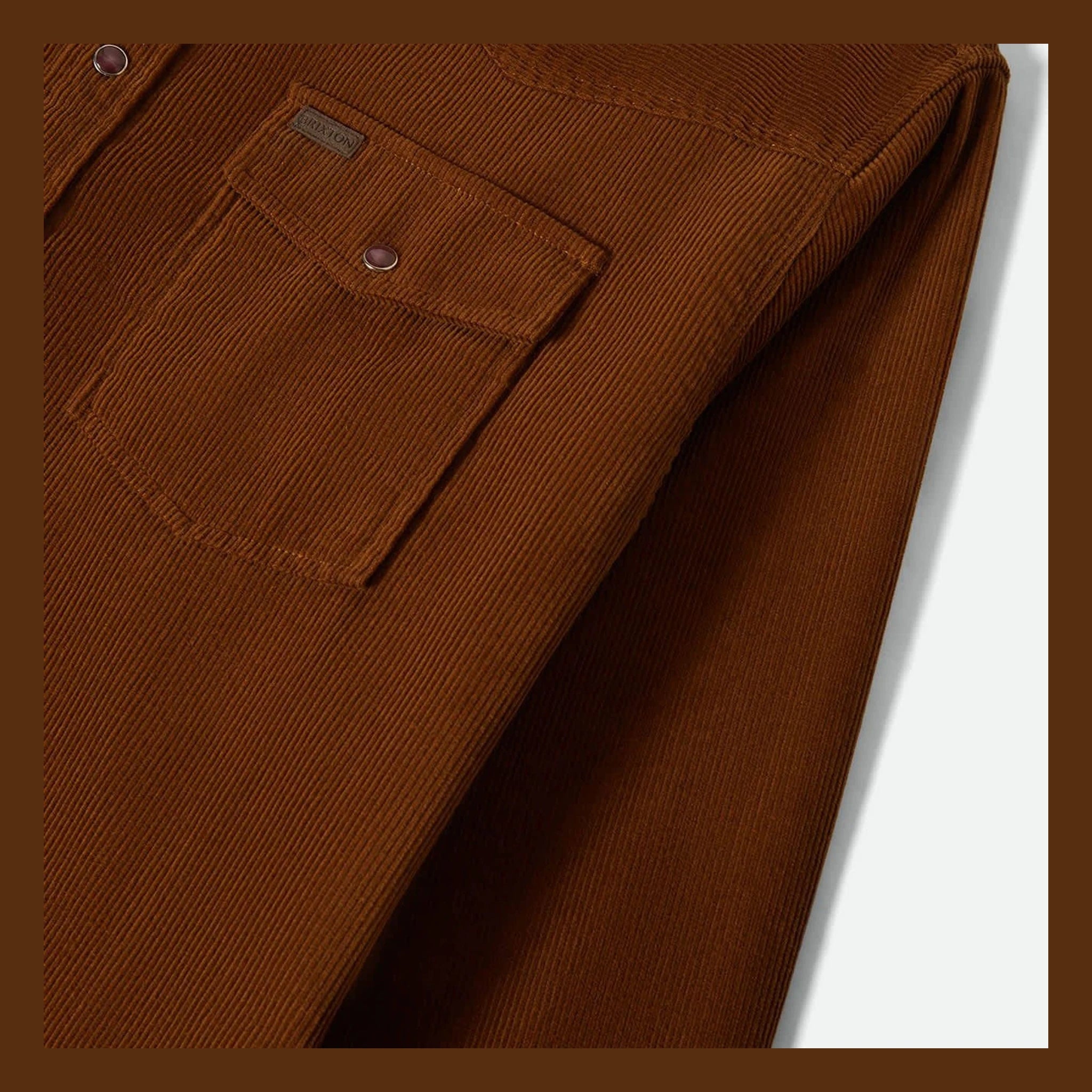 Close-up of New West Relaxed Overshirt Washed Copper Cord Jacket showing Copper corduroy fabric with fine ribbed texture and