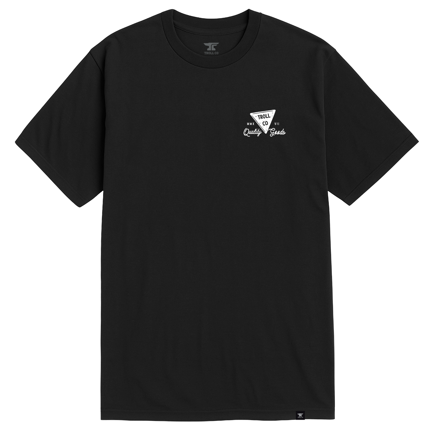 Close-up of No Magic Black Tee showing Black tee with small white chest graphic featuring triangular shield logo and