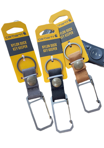 Close-up of Nylon Duck Key Keeper Accessory Grey Accessory showing Metal carabiner with nylon webbing strap, brass snap