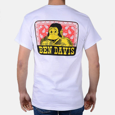Back of Paisley Black Tee, Back graphic of yellow portrait with red paisley background and black banner with yellow text -
