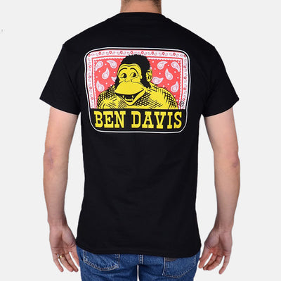 Paisley front view, Black with yellow and red portrait graphic, white border frame, and yellow text below, Black Tee -