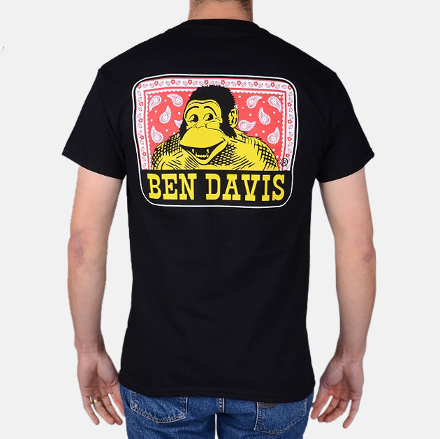Paisley front view, Black with yellow and red portrait graphic, white border frame, and yellow text below, Black Tee -