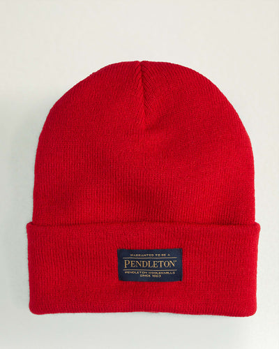 front view, Bright red knit beanie with dark woven label at cuff reading "Warranted to be a Pendleton" and "Pendleton Woolen