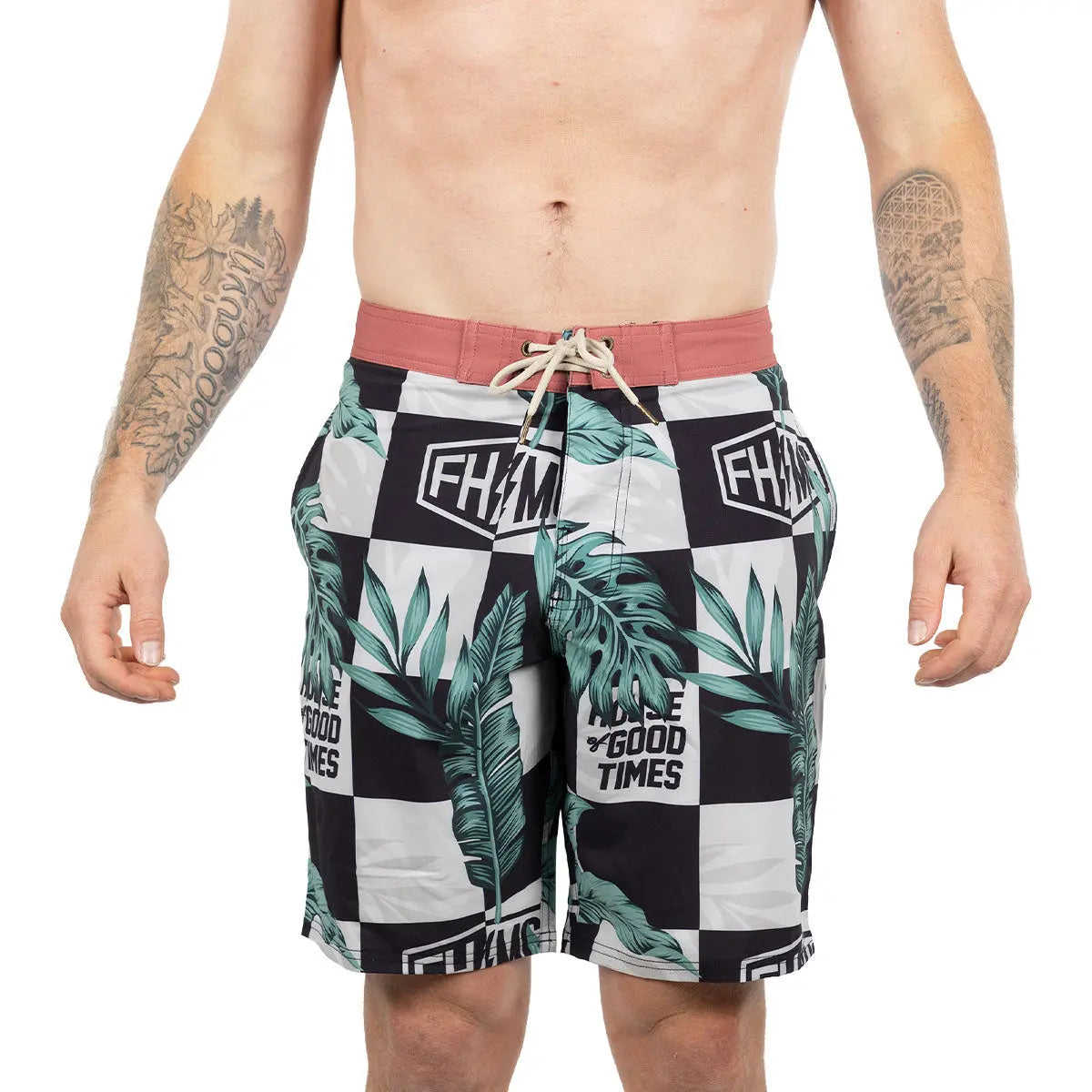 Person wearing Poolside 19" Boardshort Apparel Black/Off White Apparel, Shirtless man wearing checkered boardshorts against