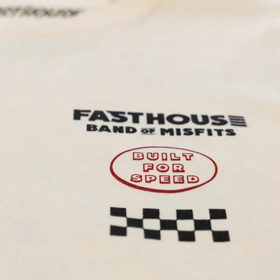 Close-up of Pursuit Natural Tee showing Black text reading "FASTHOUSE BAND OF MISFITS" with red oval stamp "BUILT FOR SPEED"