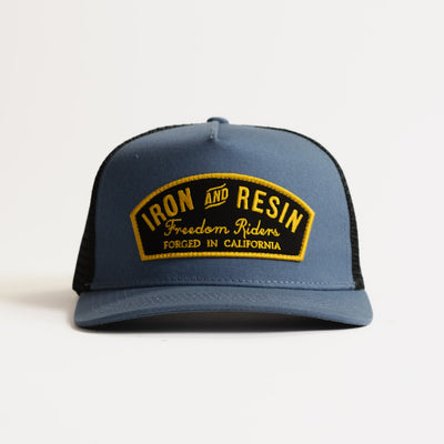 Ranger front view, Dark slate with black mesh back and gold embroidered patch reading "Iron and Resin Freedom Riders Forged