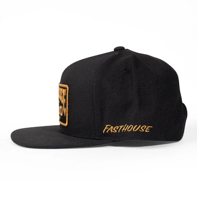 Close-up of Record Hat Apparel Black Apparel showing Black snapback cap with gold embroidered side patch and gold script