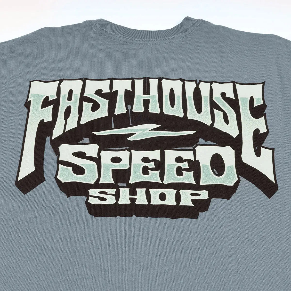 Close-up of Record Natural Tee showing Slate blue with cream and black bold lettered graphic, mint green accents, and