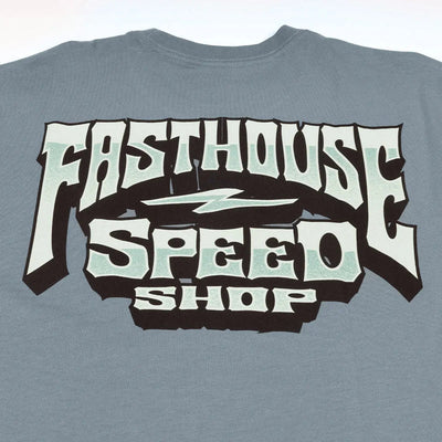 Close-up of Record Natural Tee showing Slate blue with cream and black bold lettered graphic, mint green accents, and
