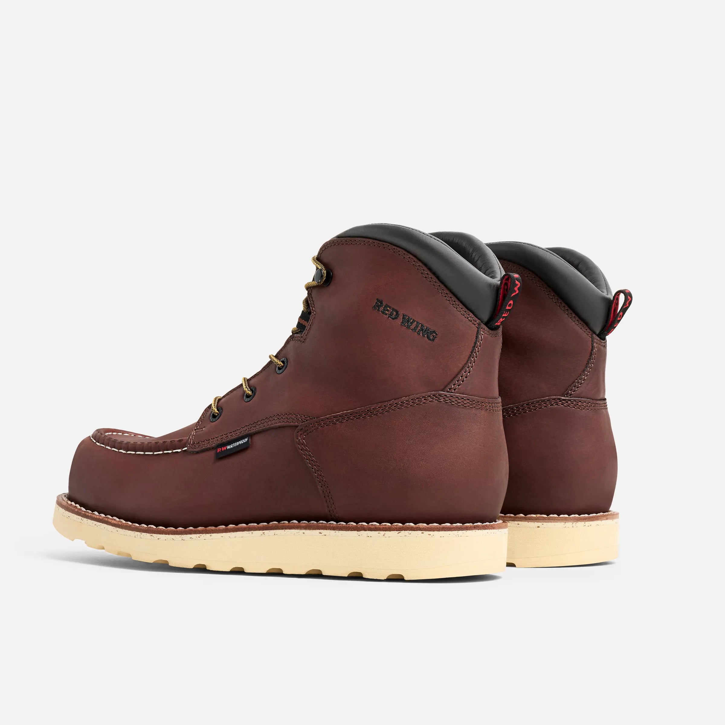 Close-up of 2415- Traction Tred Boots Boots showing Brown nubuck upper with cream wedge sole and brass eyelets, rear pull