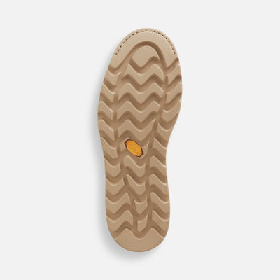 Close-up of 1222- Traction Tred Lite Boots Boots showing Tan rubber sole with wavy tread pattern and yellow brand medallion