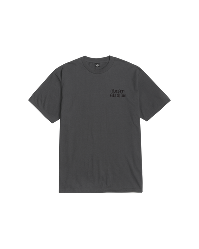 Close-up of Revoke Black Tee showing Charcoal gray with small black gothic-style text reading "Loser Machine" on chest -