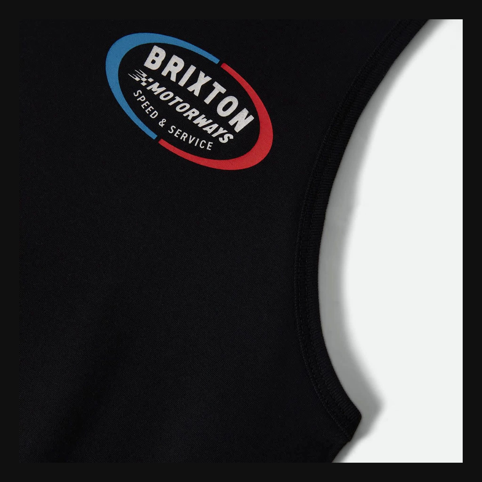 Close-up of Rhett Tank Top Apparel Black Apparel showing Red and blue oval graphic with cream text reading "Brixton