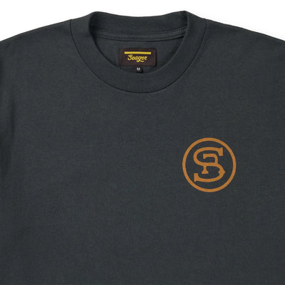 Close-up of Ride for the Brand Vintage Black Tee showing Crew neck collar with ribbed trim and woven label showing gold