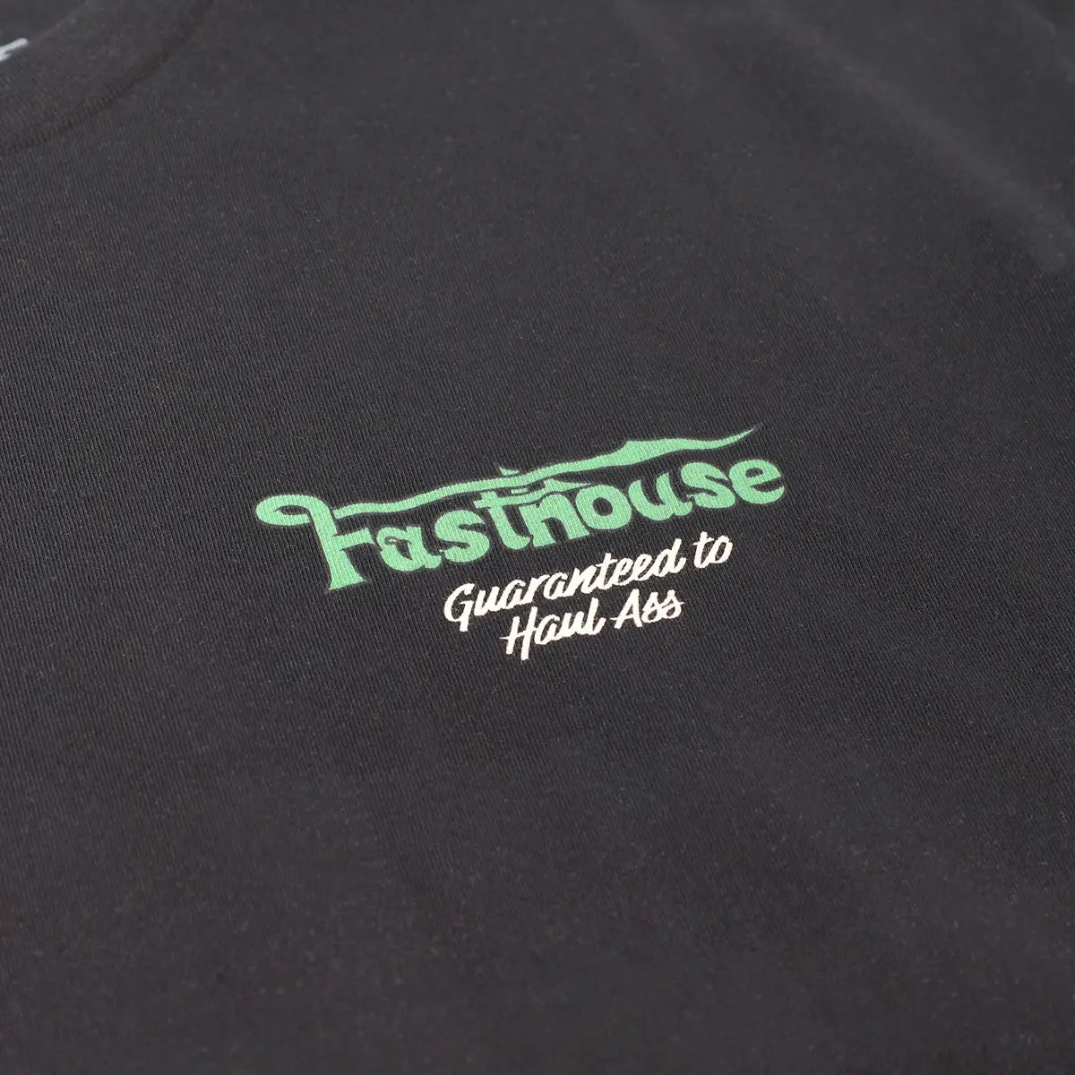 Close-up of Savanna Tee Black Black Tee showing Mint green and white embroidered graphic with stylized text on black cotton