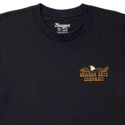 Close-up of SGR Big Rig Black Tee showing Crew neckline with ribbed binding and interior neck label reading size and fiber