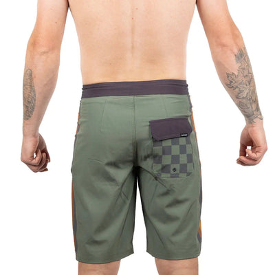 Person wearing Skeg 21" Boardshorts Apparel Olive Apparel, Wearer shown shirtless against neutral white background -