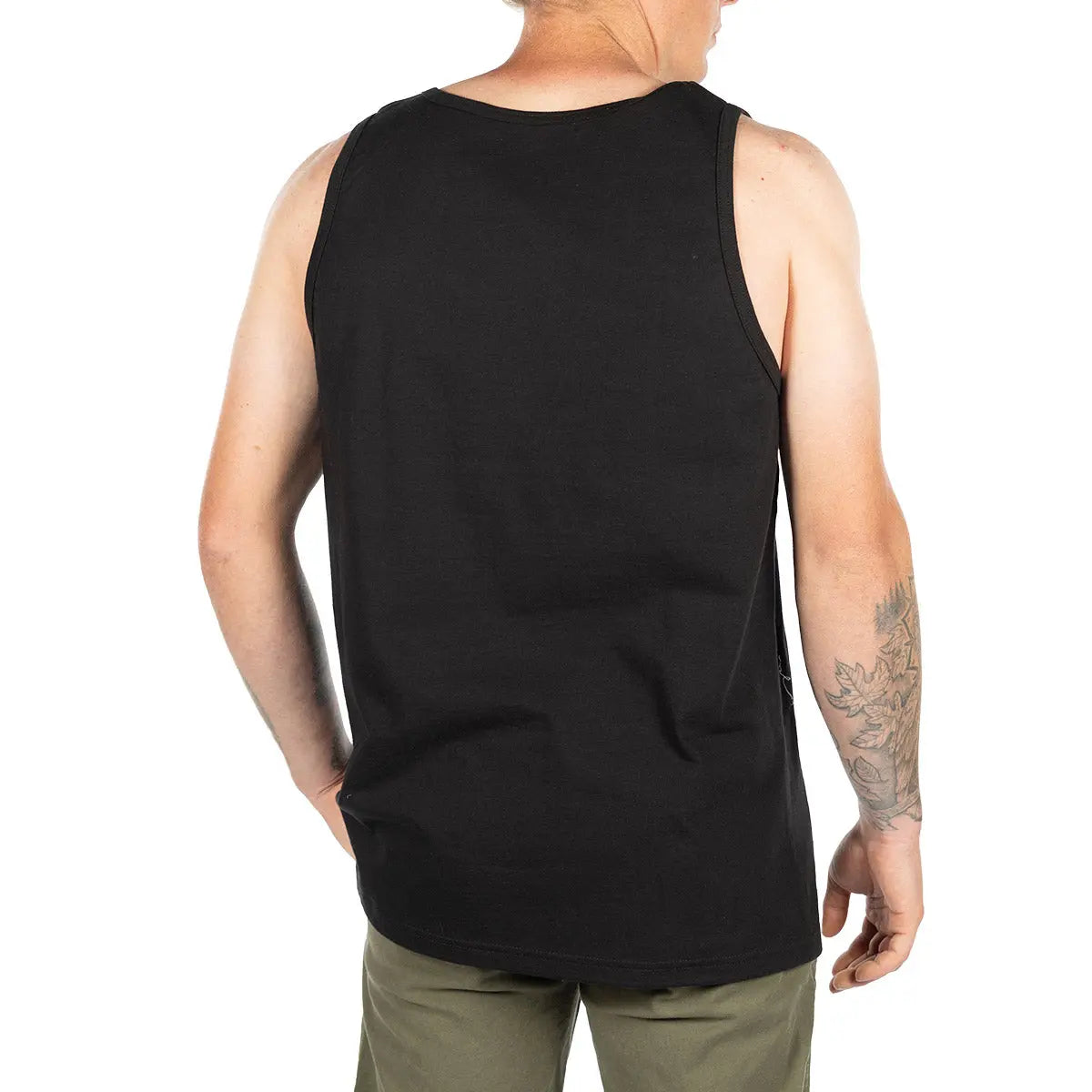 Person wearing Soar Tank Apparel Black Apparel, Man wearing black tank top against plain white background - Slowride Supply