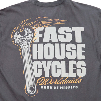 Close-up of Spanner Mirage Gray Tee showing Mirage gray with white block lettering, orange and white flaming wrench graphic,
