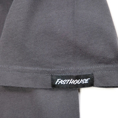 Close-up of Spanner Mirage Gray Tee showing Black woven label with white text on gray ribbed hem - Slowride Supply