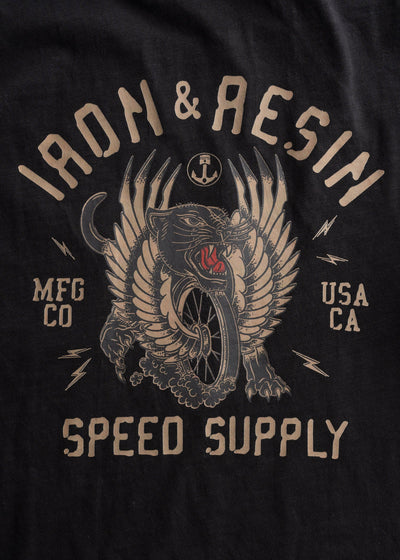 Close-up of Speed Supply Black Tee showing Tan and red winged beast graphic with anchor, lightning bolts, and text detail -