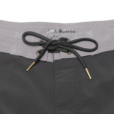 Close-up of Stealth 21" Boardshort Boardshorts Black Boardshorts showing Gray waistband with embroidered text and black