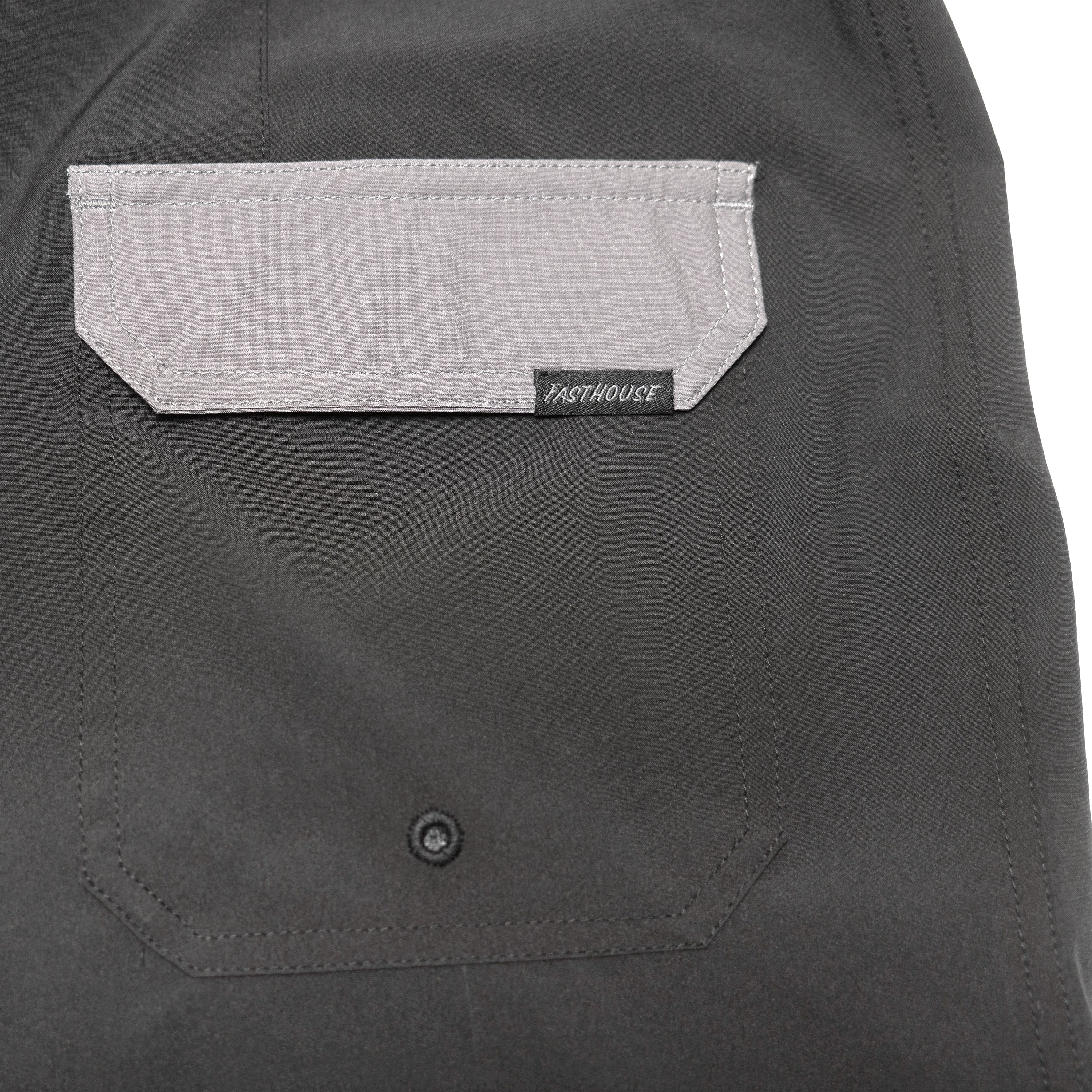 Close-up of Stealth 21" Boardshort Boardshorts Black Boardshorts showing Gray suede chest pocket with white topstitching and