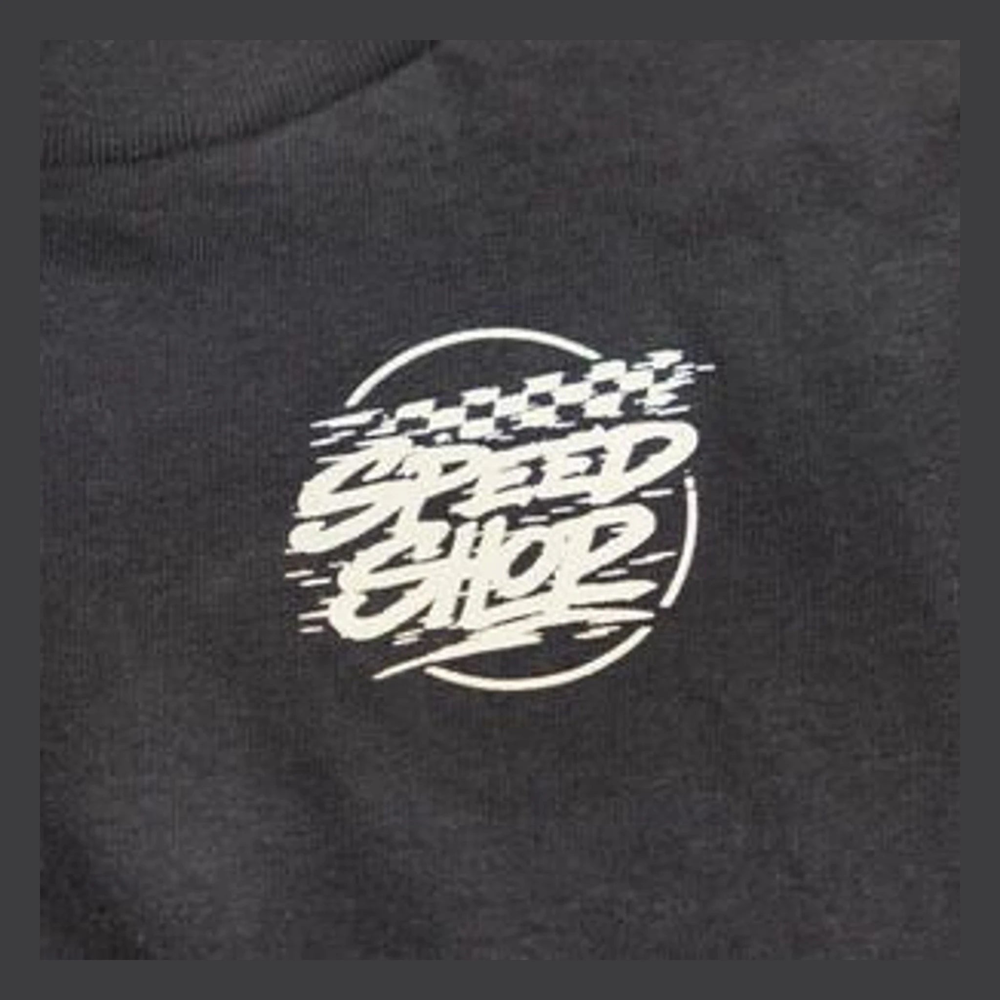 Close-up of Toddler Burner Tee Kids Black Kids Tee showing White screenprinted graphic with motion lines and circular border