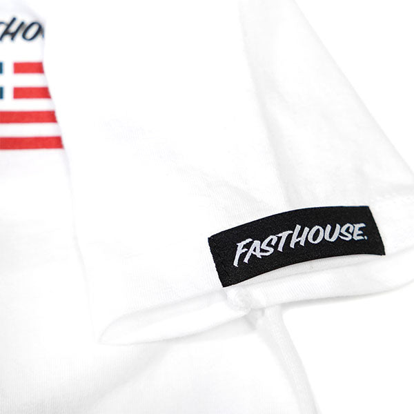 Care label on Toddler Liberty Tee White Kids White Kids Tee showing Black woven label with white cursive text on white