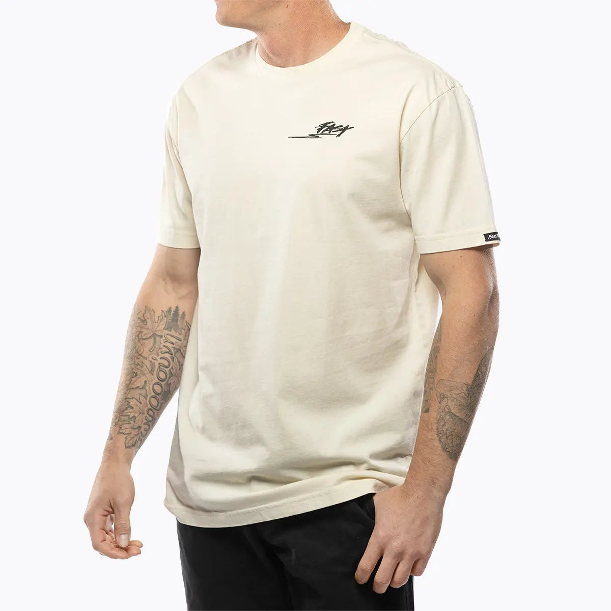 Person wearing Tomahawk Natural Tee, Worn casually against a plain white studio backdrop - Slowride Supply