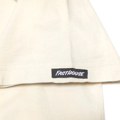 Care label on Tomahawk Natural Tee showing Black woven label with white italic text on cream fabric - Slowride Supply