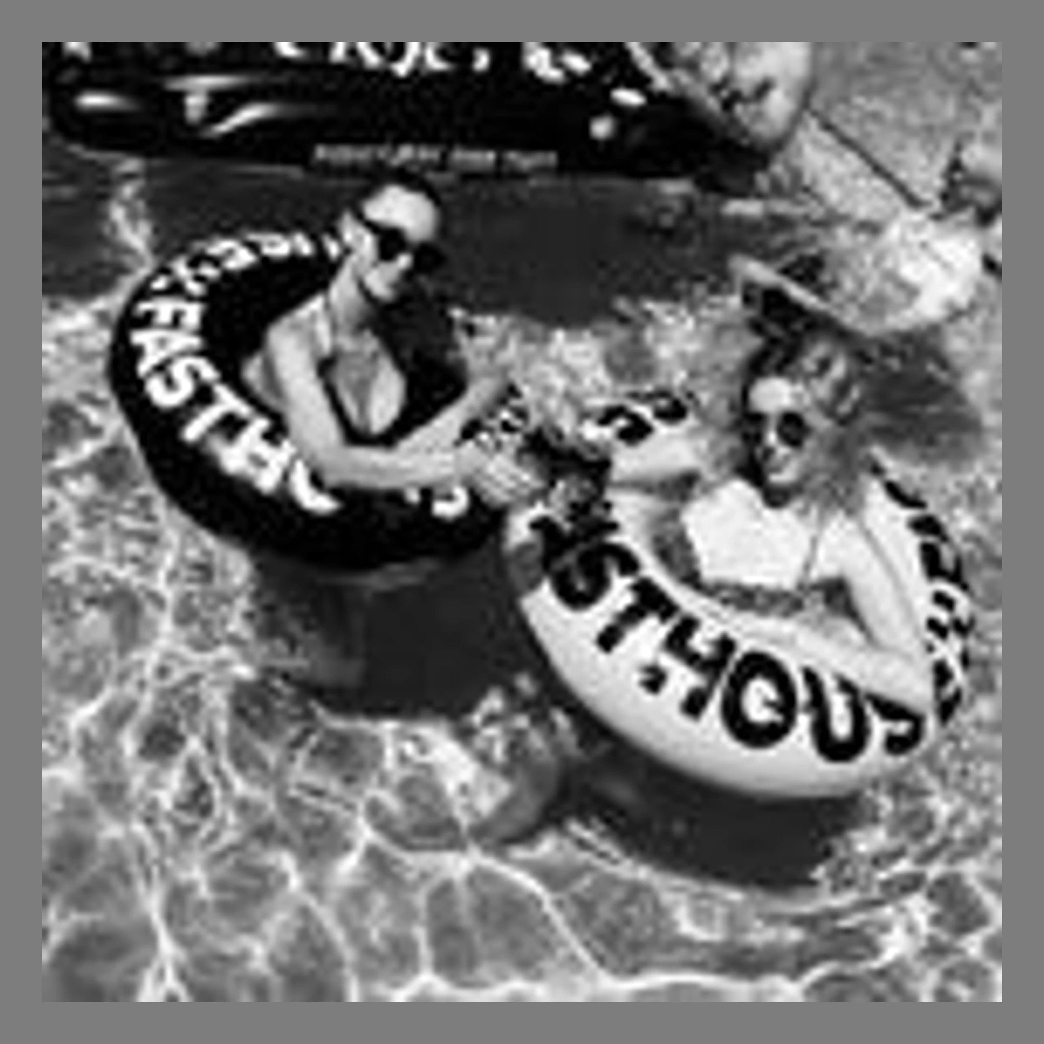 Person wearing Twister Pool Floatie Accessory Yellow/black Accessory, Person in water wearing black and white swimwear with